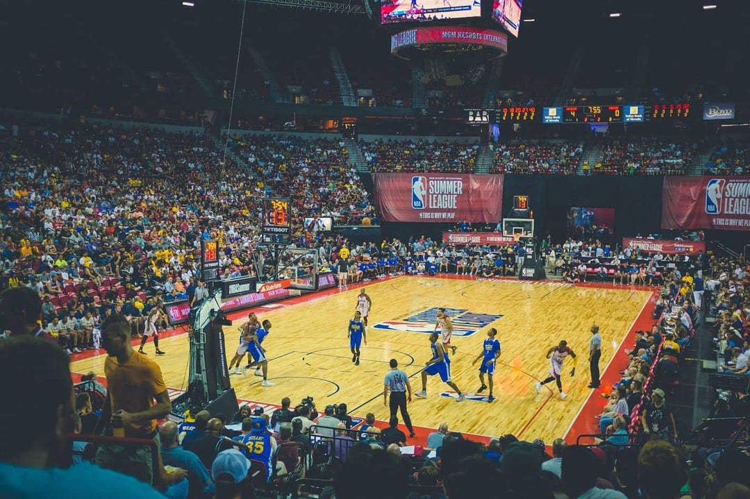 NBA stadium with two teams playing